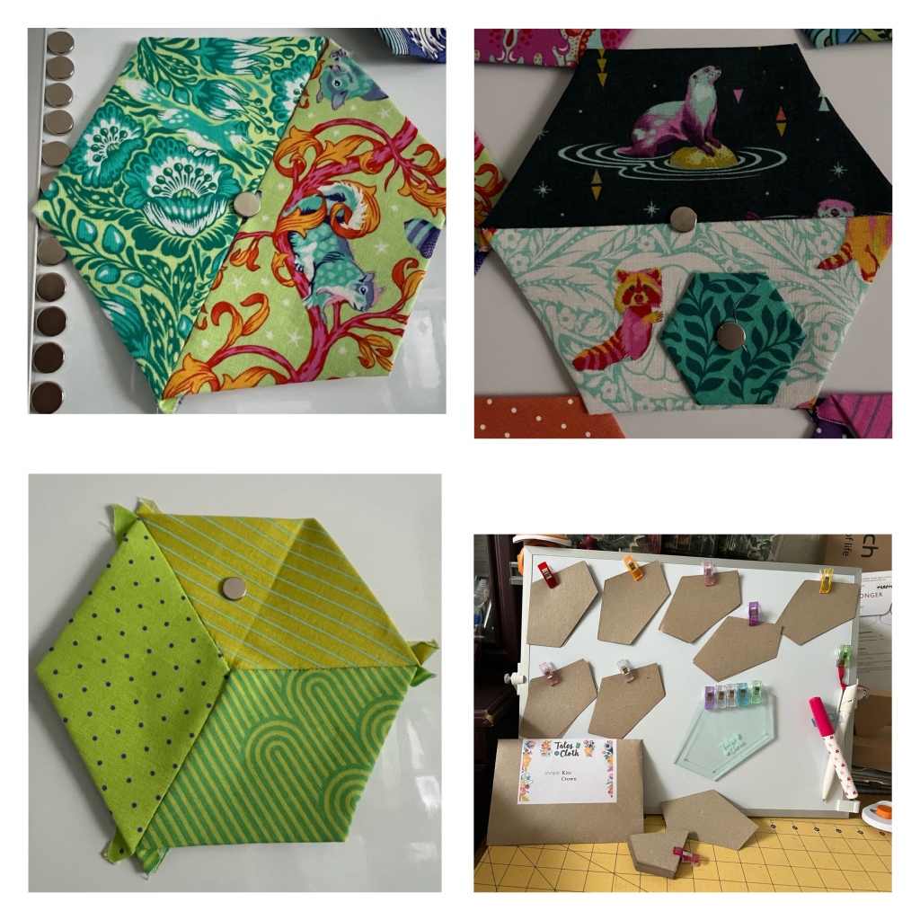 Collage of 4 photos. 
Top left half hexagon block. Green and teal fox and floral print on lime background sewn to teal squirrel on a pink branch with orange leaves print on a lime green background. Seam runs diagonally top right to bottom left.
Top right My half hexagon I first made a few days ago. Seam runs horizontally. Top half hexagon has a pink and teal otter standing with back paws in water, front paws on a lime green rock. A second otter is peeping over the seam just his nose and eyes. The background print is triangles and stars scattered on black. The bottom half of the block is a pink and orange raccoon hugging an apple core (white with the lines drawn in teal) a second raccoon is walking out of the block under the peeping otter only his tail and bottom still on the block. The background print is white flowers and leaves on teal. 
Next to the raccoon is a second smaller hexagon for scale. My large hexagons have 3 inch sides the small one has 1 inch sides.
Bottom left 3 diamonds sewn together to make a hexagon top right lime with teal pinstripes, bottom right lime with green “70’s” strips (curves and straight lines), left lime with purple pin dots.
Bottom right my small whiteboard with 7 sets of crown paper templates (each crown is a third of the hexagon imagine cutting to the centre halfway along 2 sides with the side immediately adjacent to both left intact). There’s also the acrylic template (with added seam allowance for cutting fabric), glue pen, and biro.
On the table in front of the whiteboard is the envelope the paper templates were in and the kite templates that were also in the envelope.